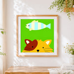 Finished cute cat and fish cross stitch artwork displayed