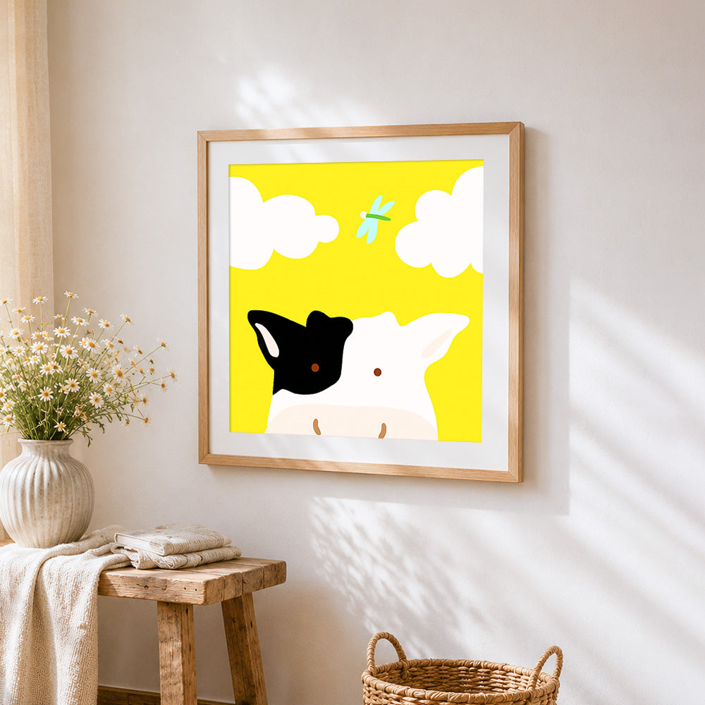 Cute cow and dragonfly cross stitch artwork displayed on wall as home decor