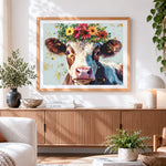 Finished cute cow with a floral crown cross stitch artwork displayed