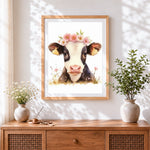 Finished cute cow with flower crown cross stitch artwork displayed