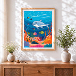 Finished cute dolphin and colourful fish cross stitch artwork displayed