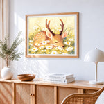 Cute fawn sleeping in a daisy field cross stitch artwork displayed on wall as home decor