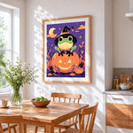 Cute frog on glowing pumpkin cross stitch artwork displayed on wall as home decor