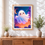 Finished cute ghost and crescent moon cross stitch artwork displayed