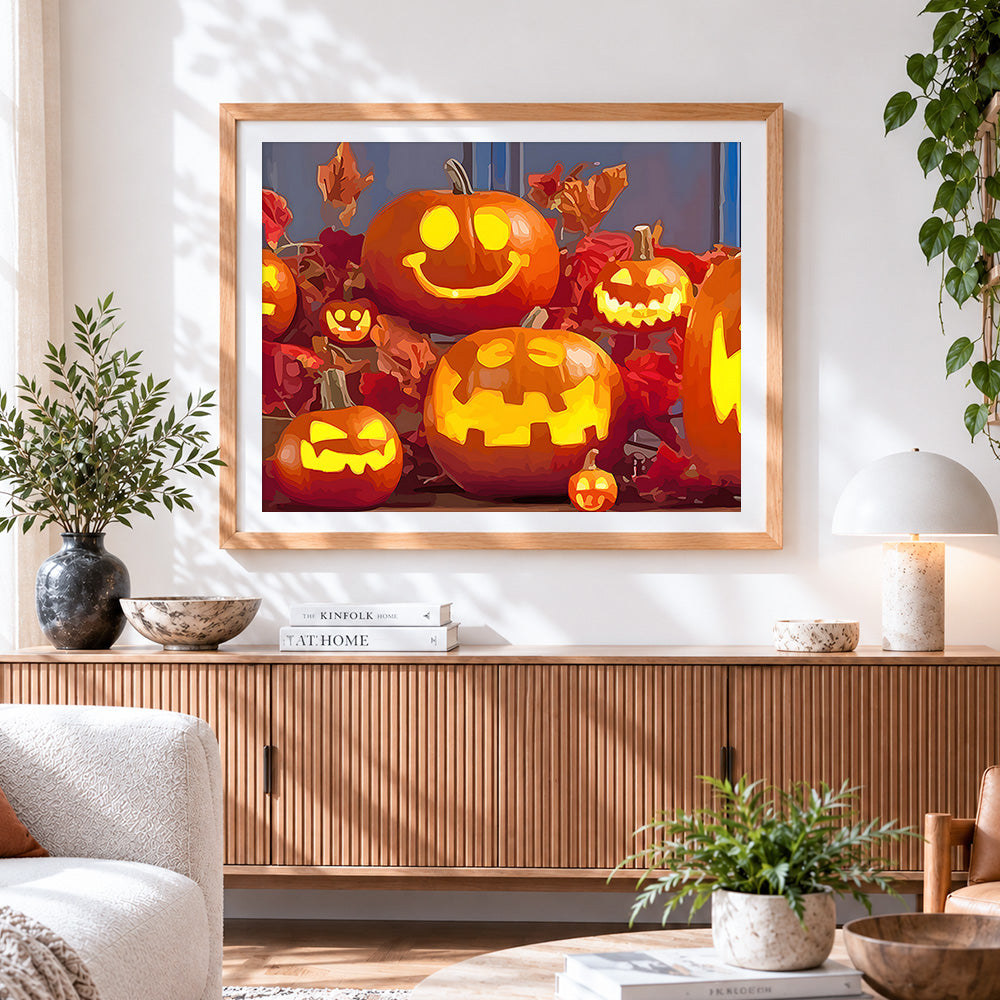 Finished cute glowing jack o lanterns cross stitch artwork displayed