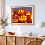 Cute glowing jack o lanterns cross stitch artwork displayed on wall as home decor