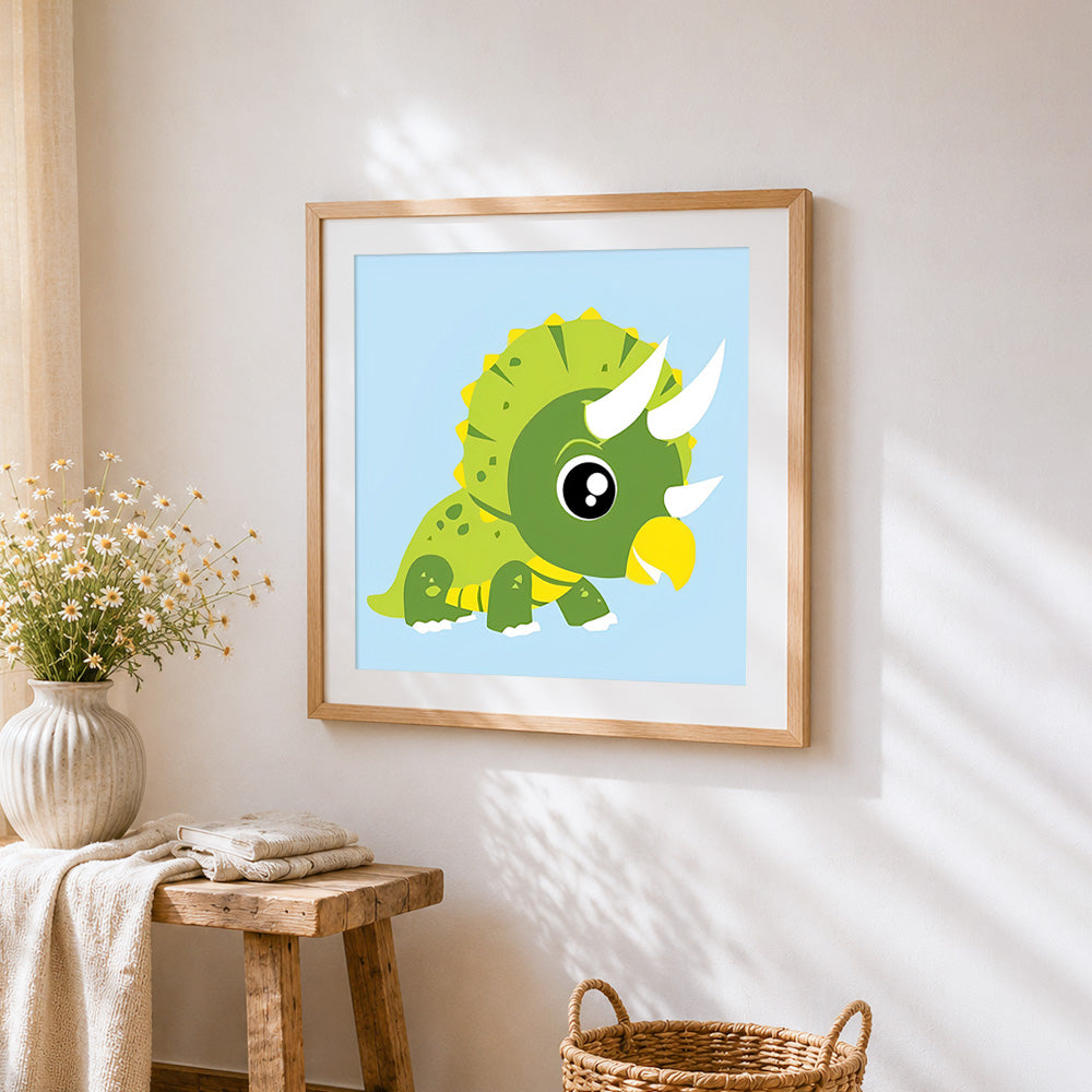 Cute green triceratops dinosaur cross stitch artwork displayed on wall as home decor