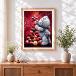 Finished cute grey bear decorating a bauble christmas tree cross stitch artwork displayed