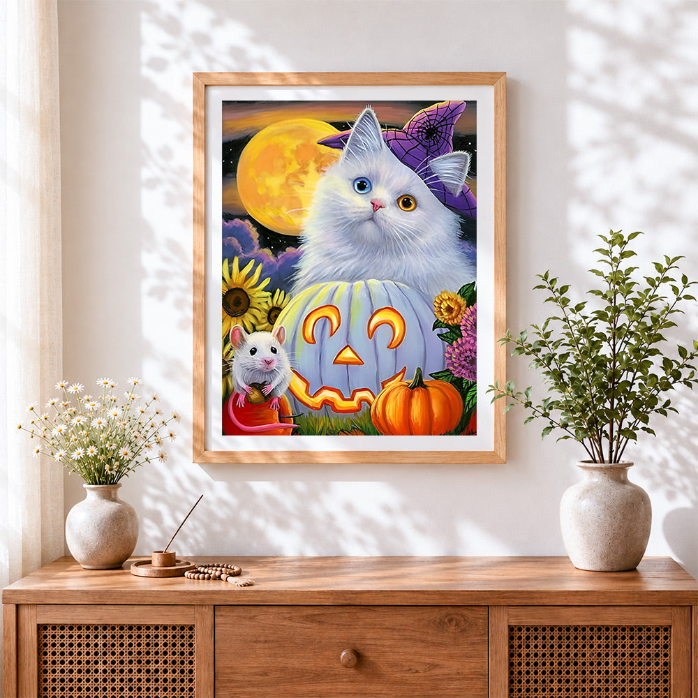 Finished cute halloween cat with jack-o'-lantern cross stitch artwork displayed