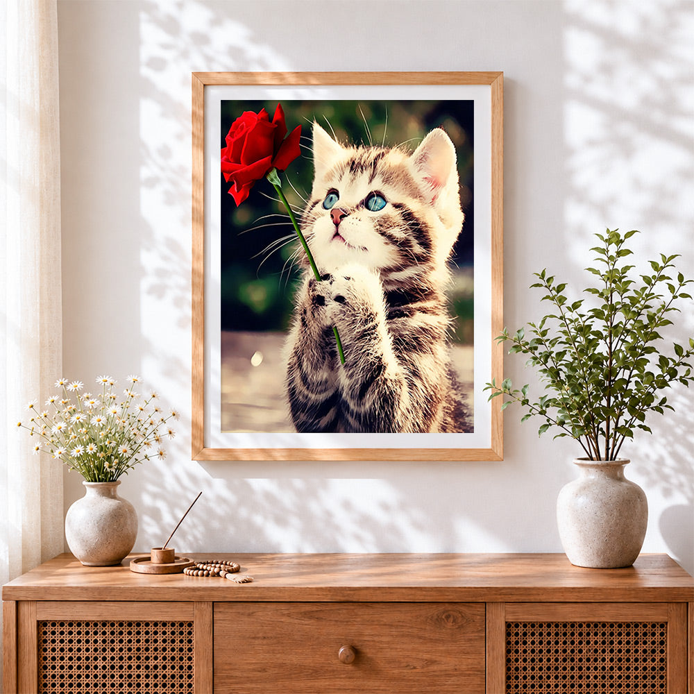Finished cute kitten holding a red rose paint by numbers artwork displayed as home decor