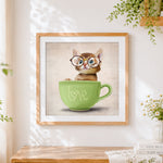 Finished cute kitten in a green "love" teacup cross stitch artwork displayed