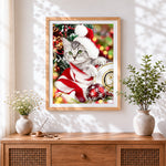 Finished cute kitten in santa hat and jumper cross stitch artwork displayed