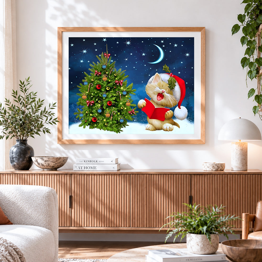Finished cute kitten singing by christmas tree cross stitch artwork displayed