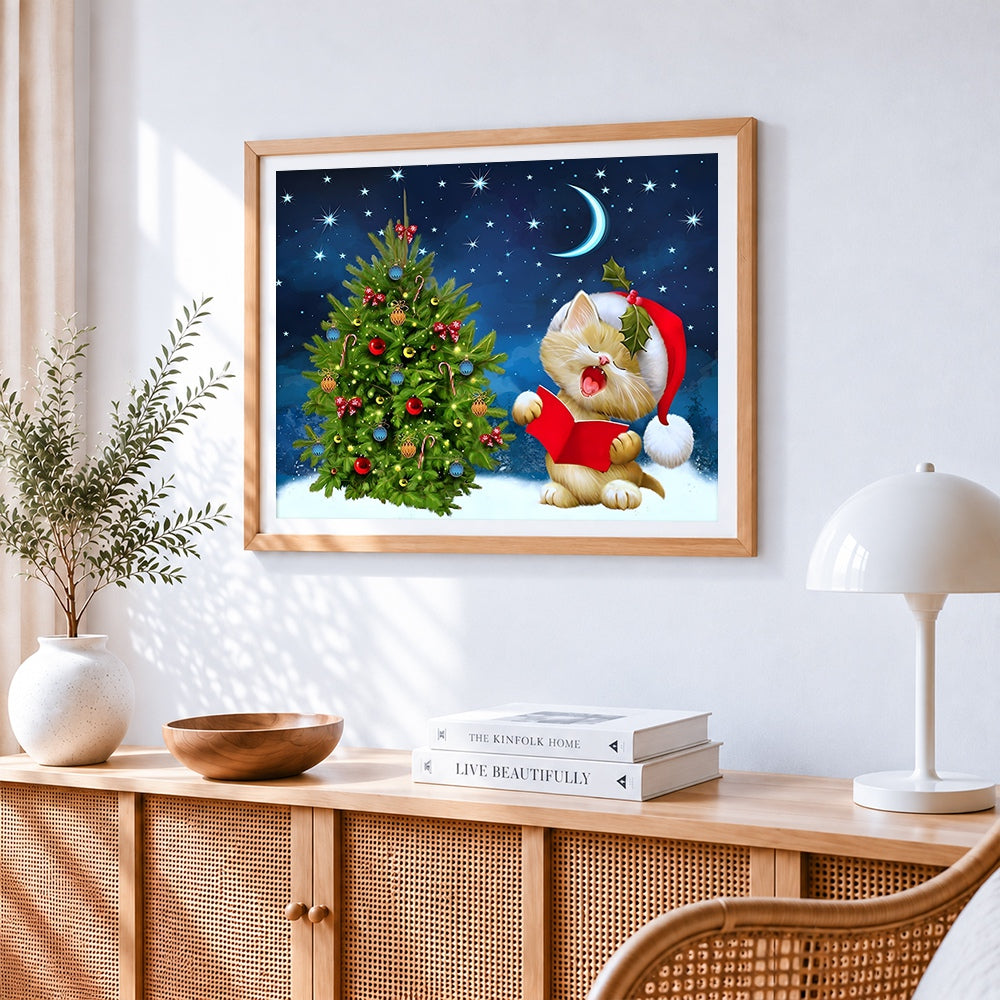 Cute kitten singing by christmas tree cross stitch artwork displayed on wall as home decor