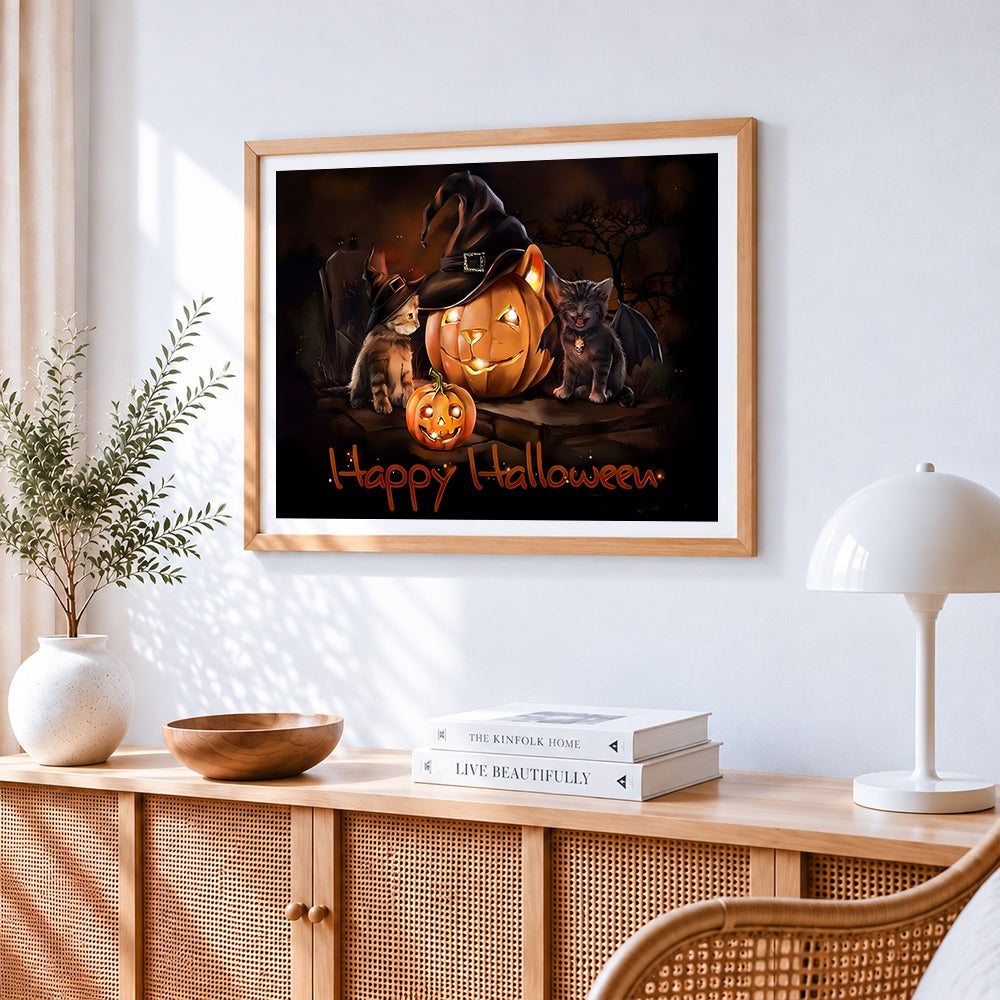 Cute kittens and witch hat pumpkin cross stitch artwork displayed on wall as home decor