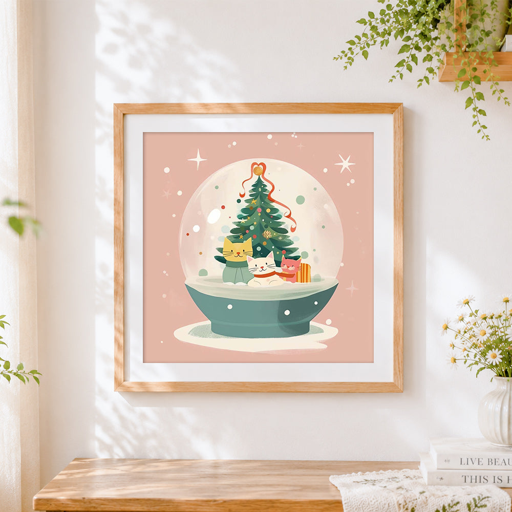 Finished cute kittens in a christmas snow globe cross stitch artwork displayed
