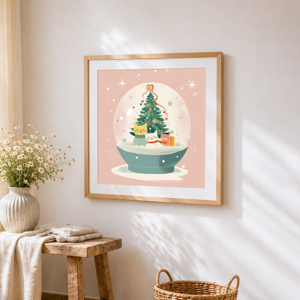 Cute kittens in a christmas snow globe cross stitch artwork displayed on wall as home decor