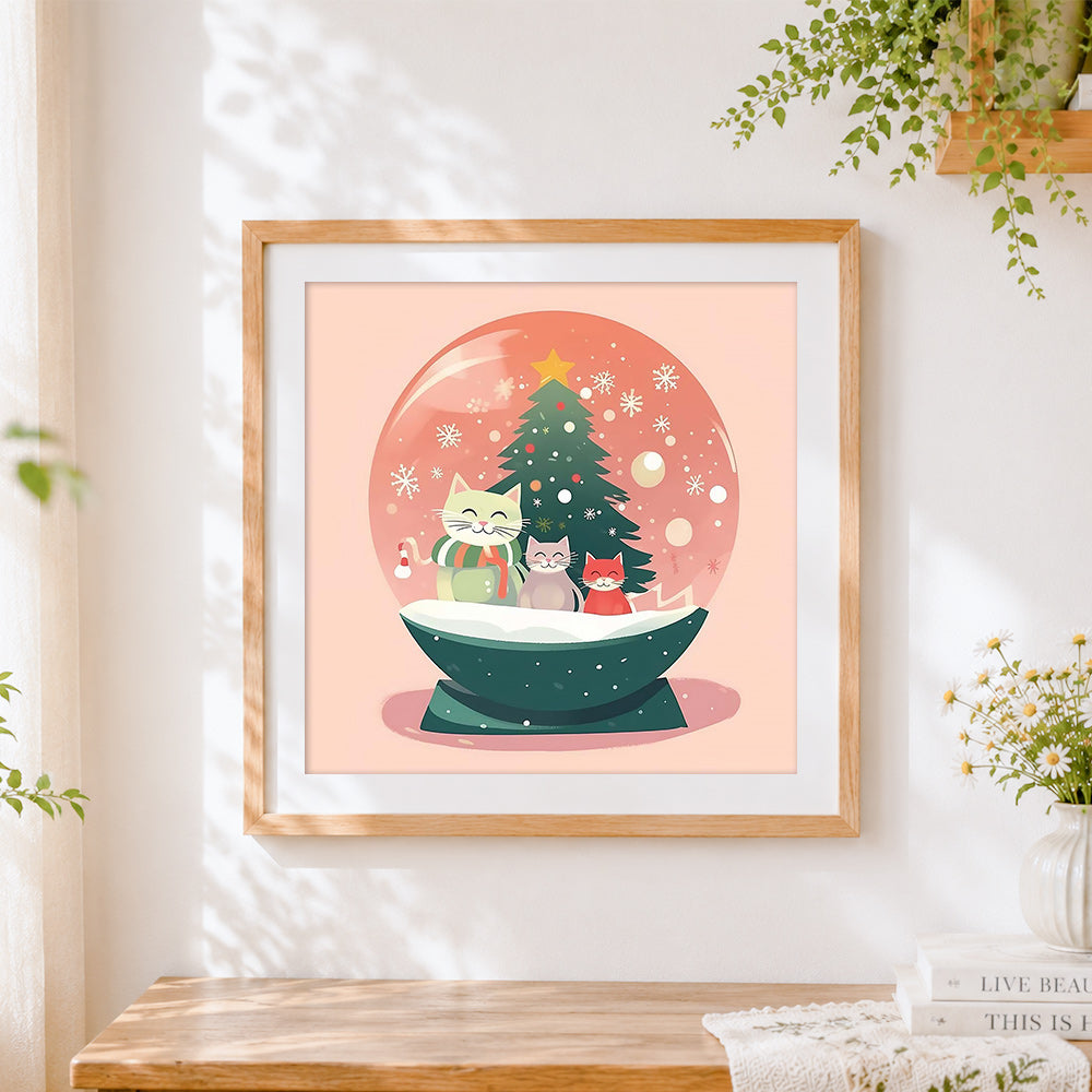 Finished cute kittens in a pink snow globe cross stitch artwork displayed