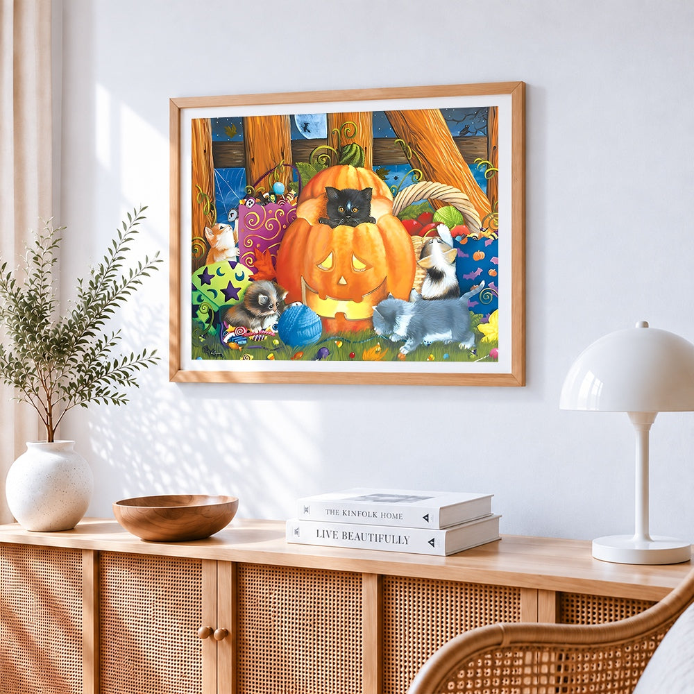 Cute kittens in a pumpkin patch cross stitch artwork displayed on wall as home decor