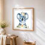 Cute koala with floral crown cross stitch artwork displayed on wall as home decor