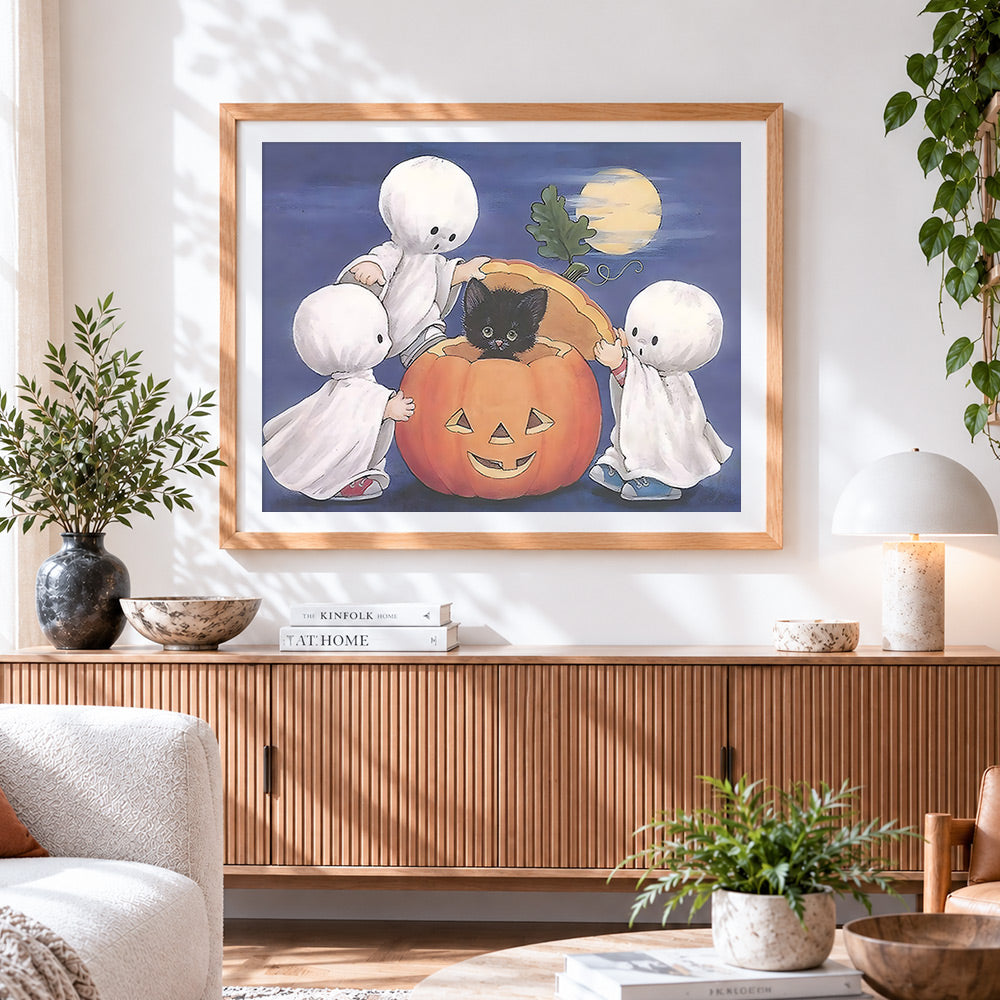 Finished cute little ghosts and pumpkin paint by numbers artwork displayed as home decor