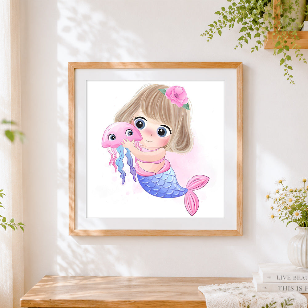 Finished cute mermaid and jellyfish cross stitch artwork displayed