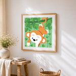 Cute monkey hanging from a vine cross stitch artwork displayed on wall as home decor