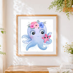 Finished cute octopus with flower crown cross stitch artwork displayed