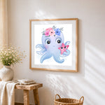 Cute octopus with flower crown cross stitch artwork displayed on wall as home decor