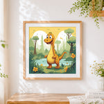 Finished cute orange dinosaur in a prehistoric forest cross stitch artwork displayed