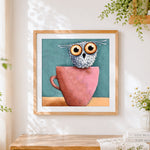 Finished cute owl in pink teacup cross stitch artwork displayed
