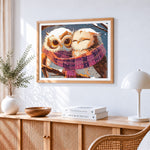 Cute owls sharing a cosy scarf cross stitch artwork displayed on wall as home decor