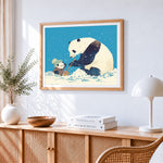 Cute pandas building a snowman cross stitch artwork displayed on wall as home decor