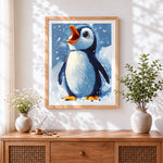 Finished cute penguin singing in the snow cross stitch artwork displayed