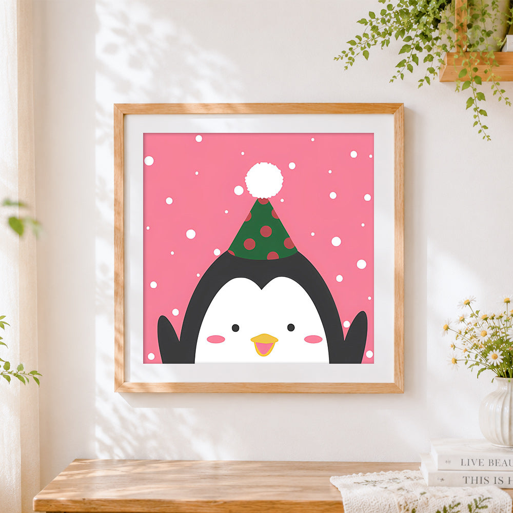 Finished cute penguin with party hat cross stitch artwork displayed