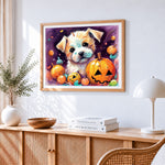 Cute puppy and halloween pumpkins cross stitch artwork displayed on wall as home decor