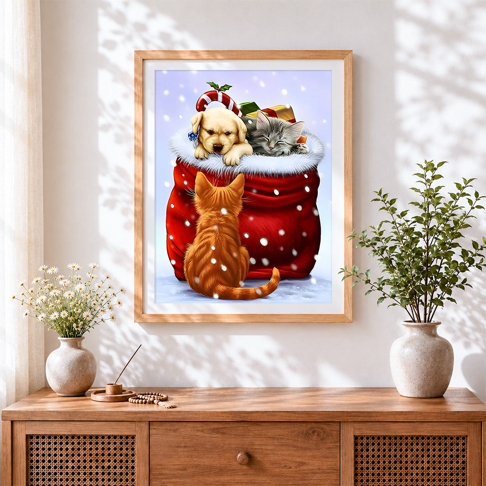 Finished cute puppy and kitten in a christmas santa sack cross stitch artwork displayed
