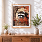 Finished cute raccoon in autumn leaves cross stitch artwork displayed