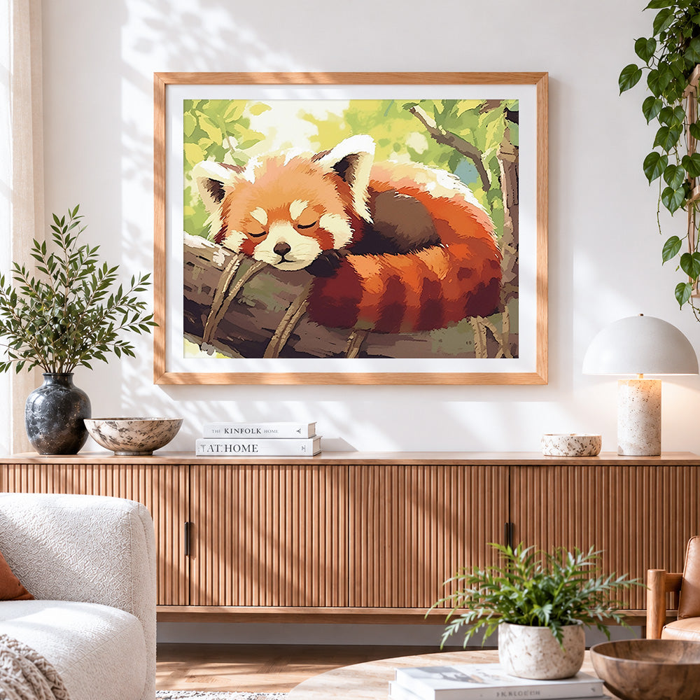 Finished cute red panda sleeping on a tree cross stitch artwork displayed