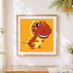 Finished cute red t-rex dinosaur cross stitch artwork displayed