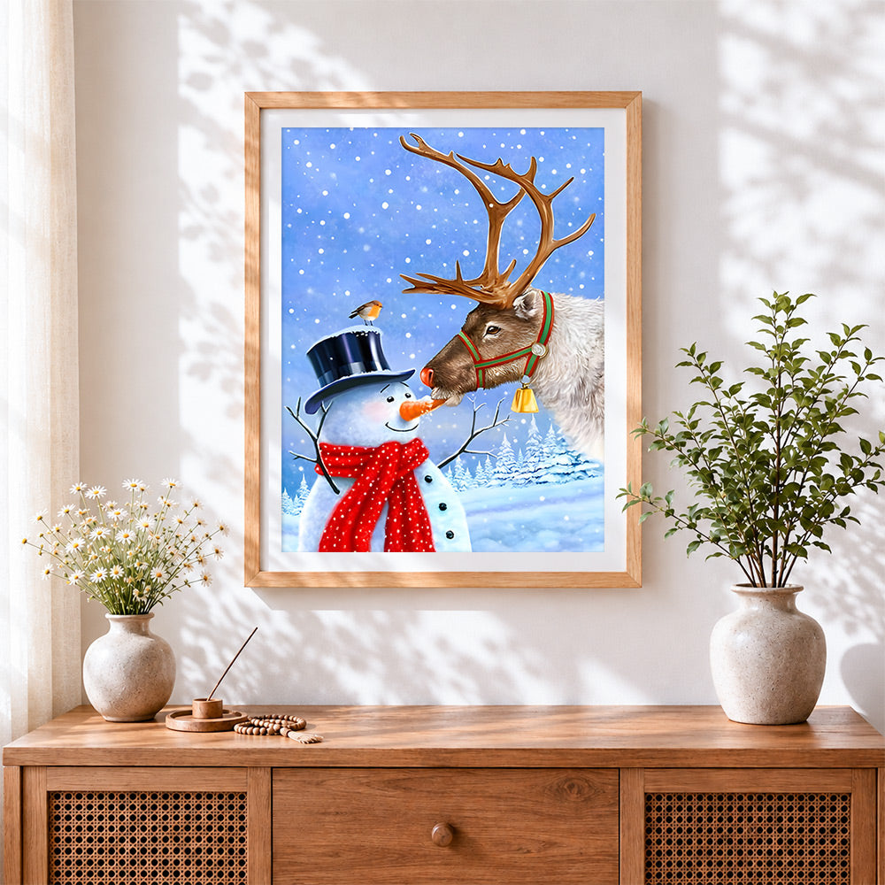 Finished cute reindeer and snowman sharing a carrot cross stitch artwork displayed