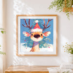 Finished cute reindeer in a santa hat cross stitch artwork displayed