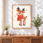 Finished cute reindeer in red scarf cross stitch artwork displayed