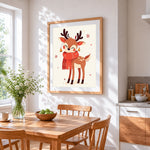 Cute reindeer in red scarf cross stitch artwork displayed on wall as home decor