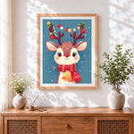 Finished cute reindeer with festive antlers cross stitch artwork displayed
