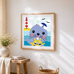 Cute sailor seal and lighthouse cross stitch artwork displayed on wall as home decor