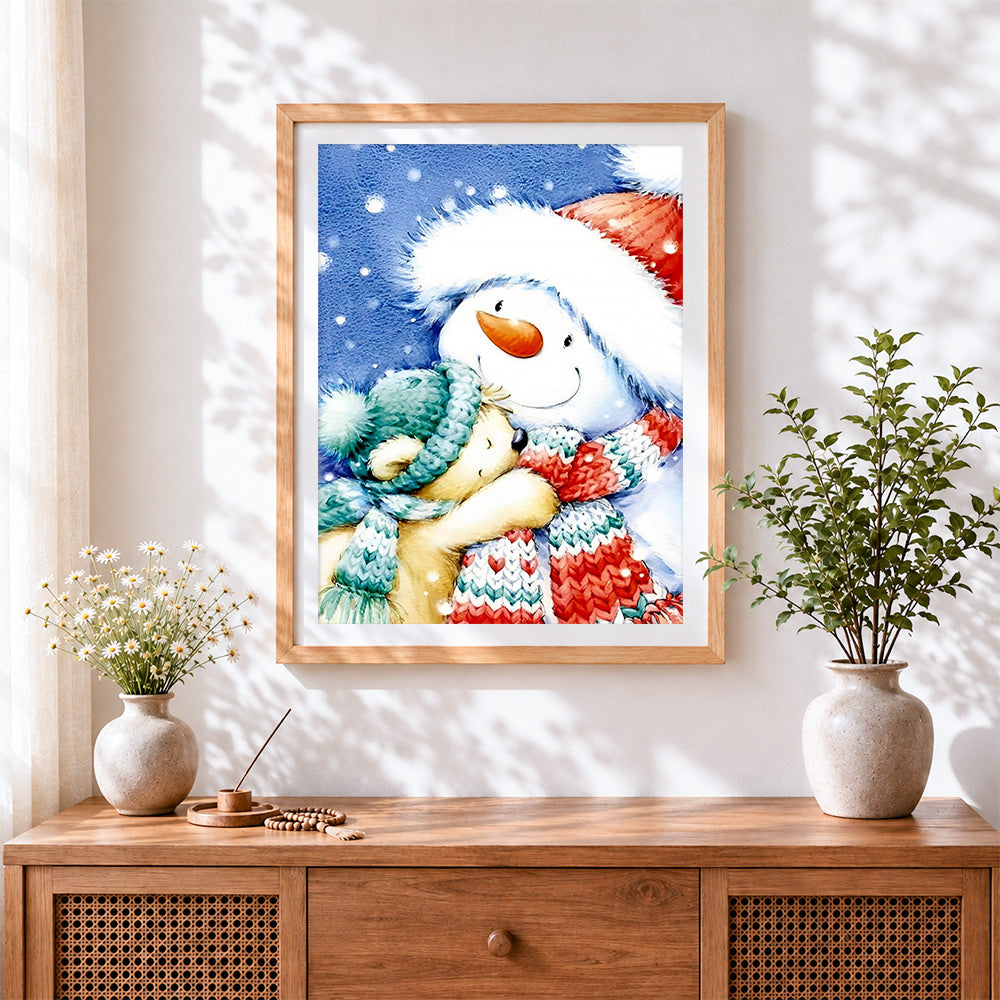 Finished cute snowman and bear cross stitch artwork displayed