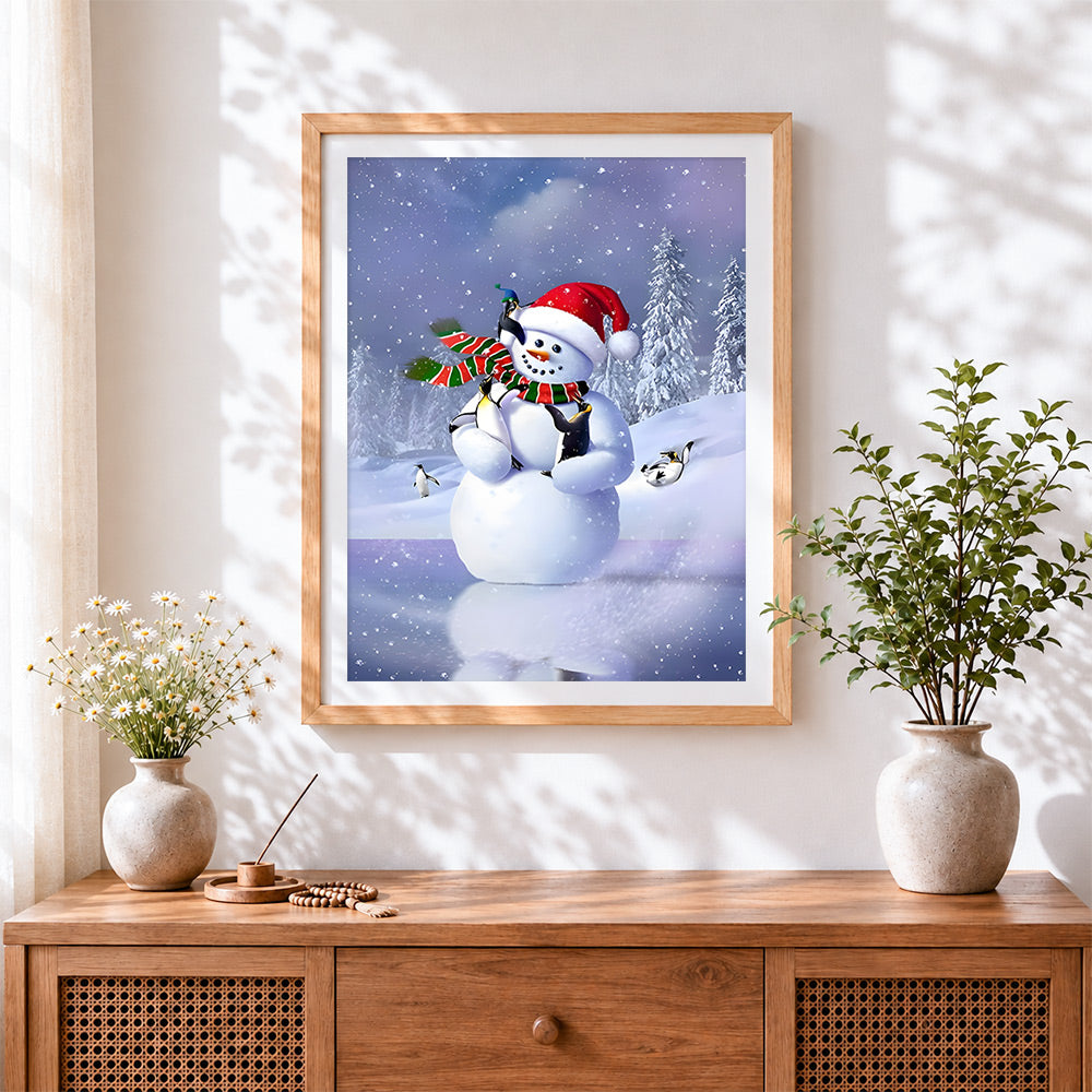 Finished cute snowman and penguins playing on the ice cross stitch artwork displayed