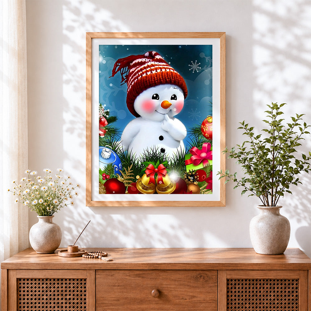 Finished cute snowman in a knitted hat cross stitch artwork displayed
