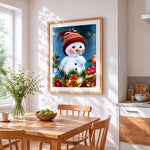 Cute snowman in a knitted hat cross stitch artwork displayed on wall as home decor